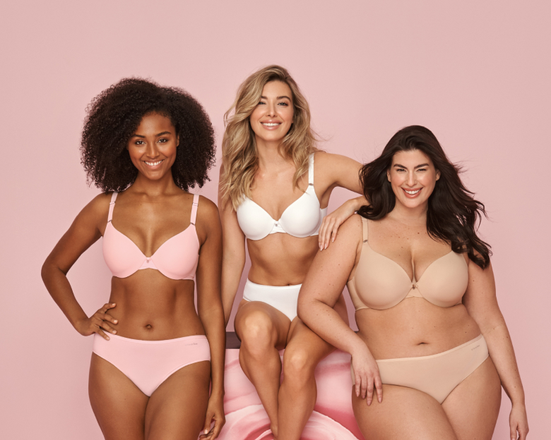 3 models wearing bra-and-panties sets in pale pink, white, and beige