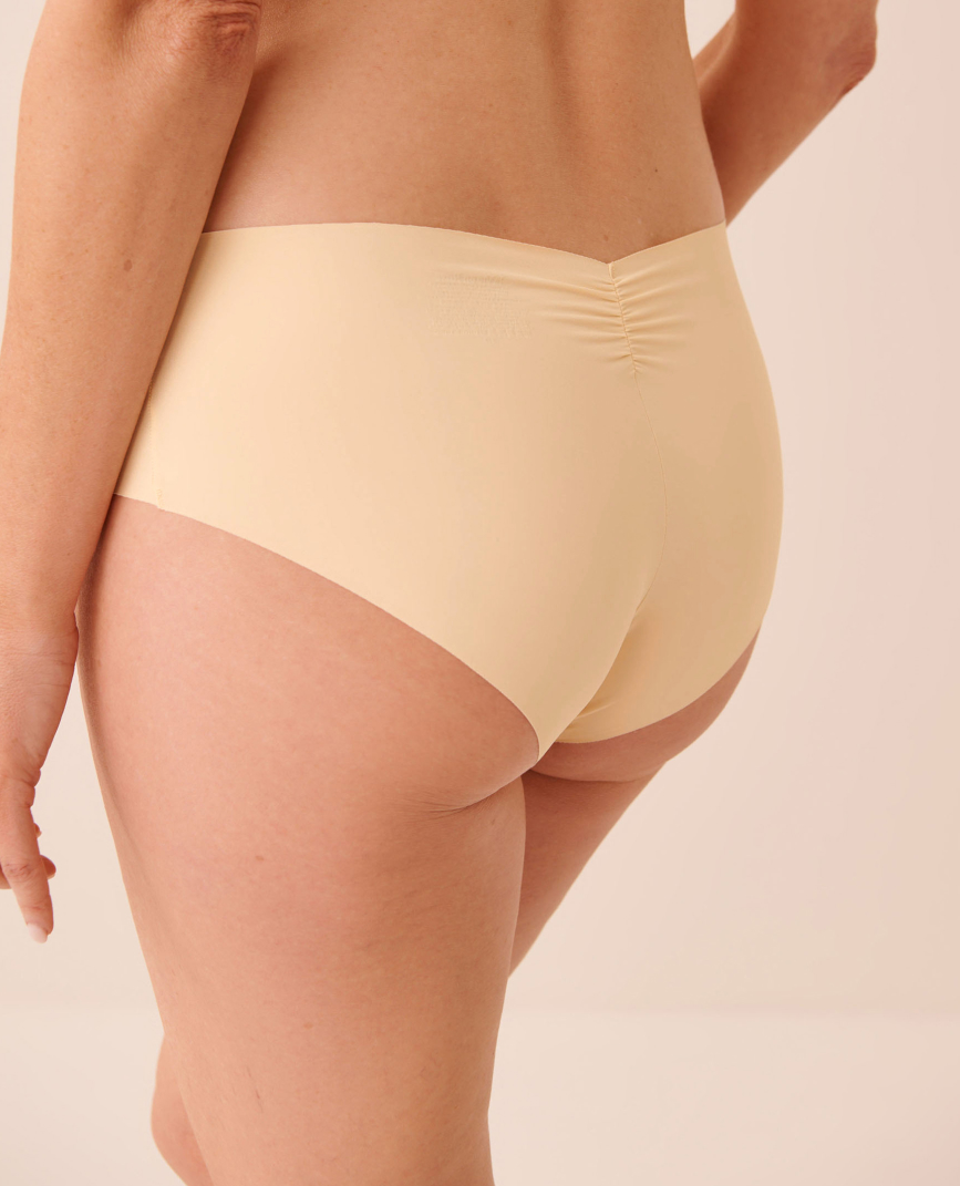 Model shown from the front wearing red panties with black floral patterns.