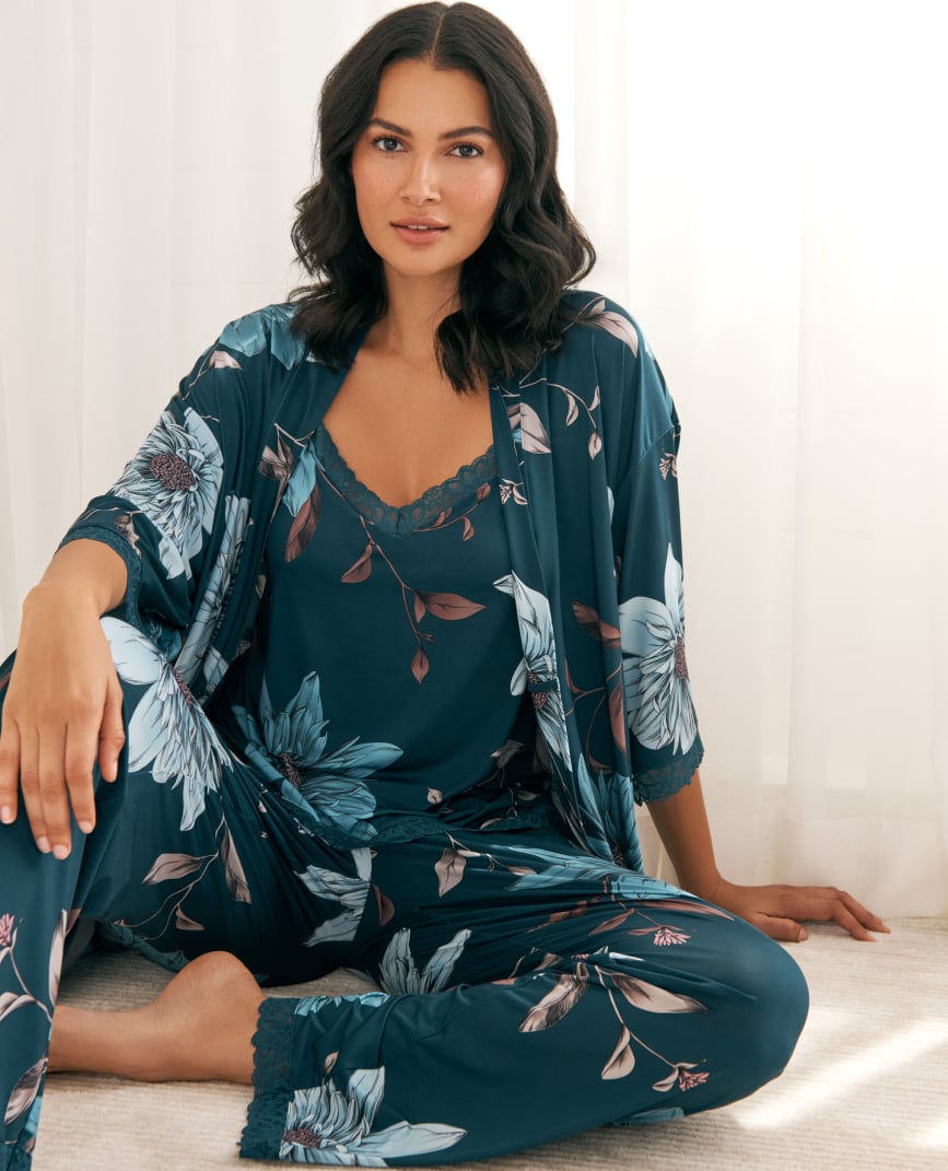 Model in teal satin floral lingerie set: camisole, pants, and kimono.