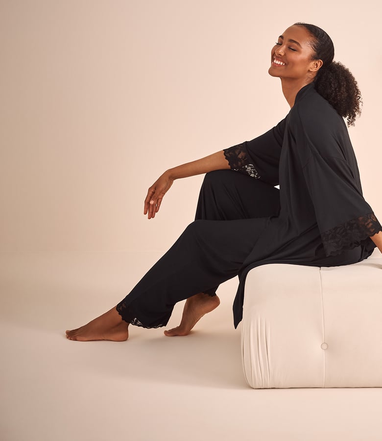Model wearing a black modal kimono with matching pants