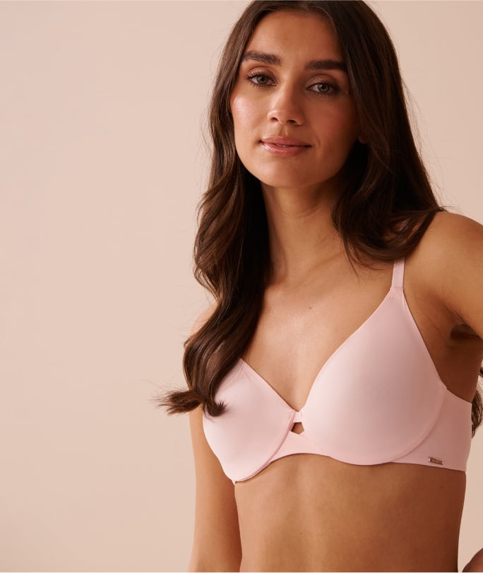 Model wearing a pale pink unlined cushioned wire bra.
