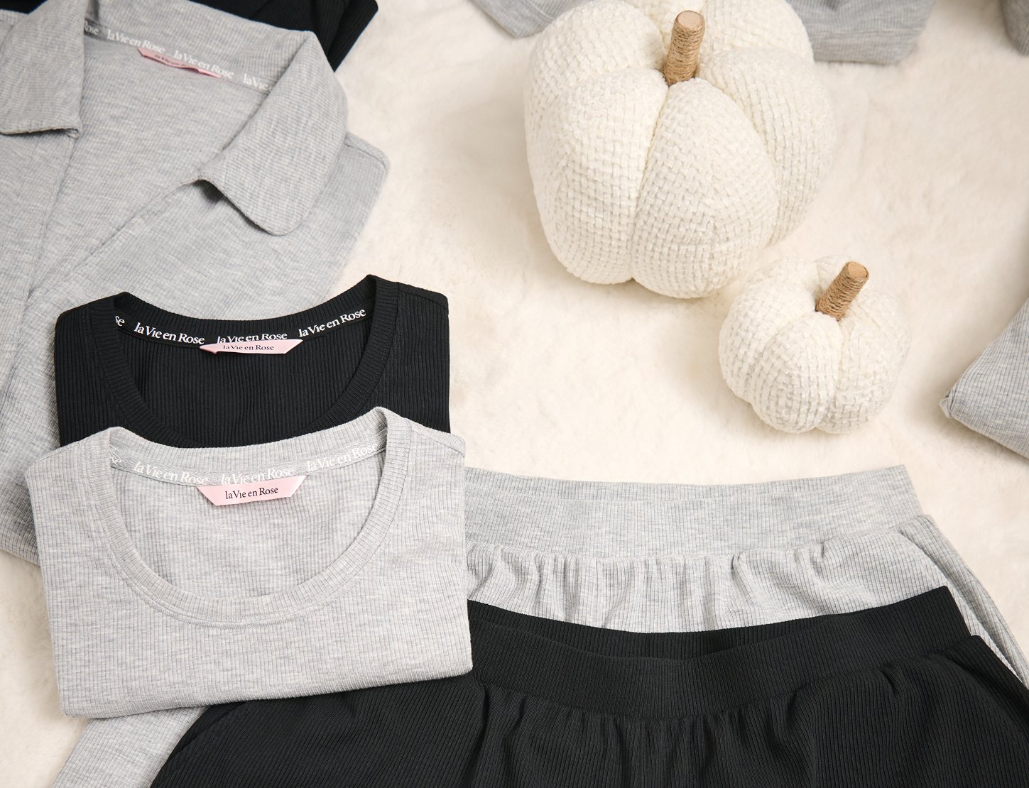 Model wearing an oversized white button-up sweatshirt