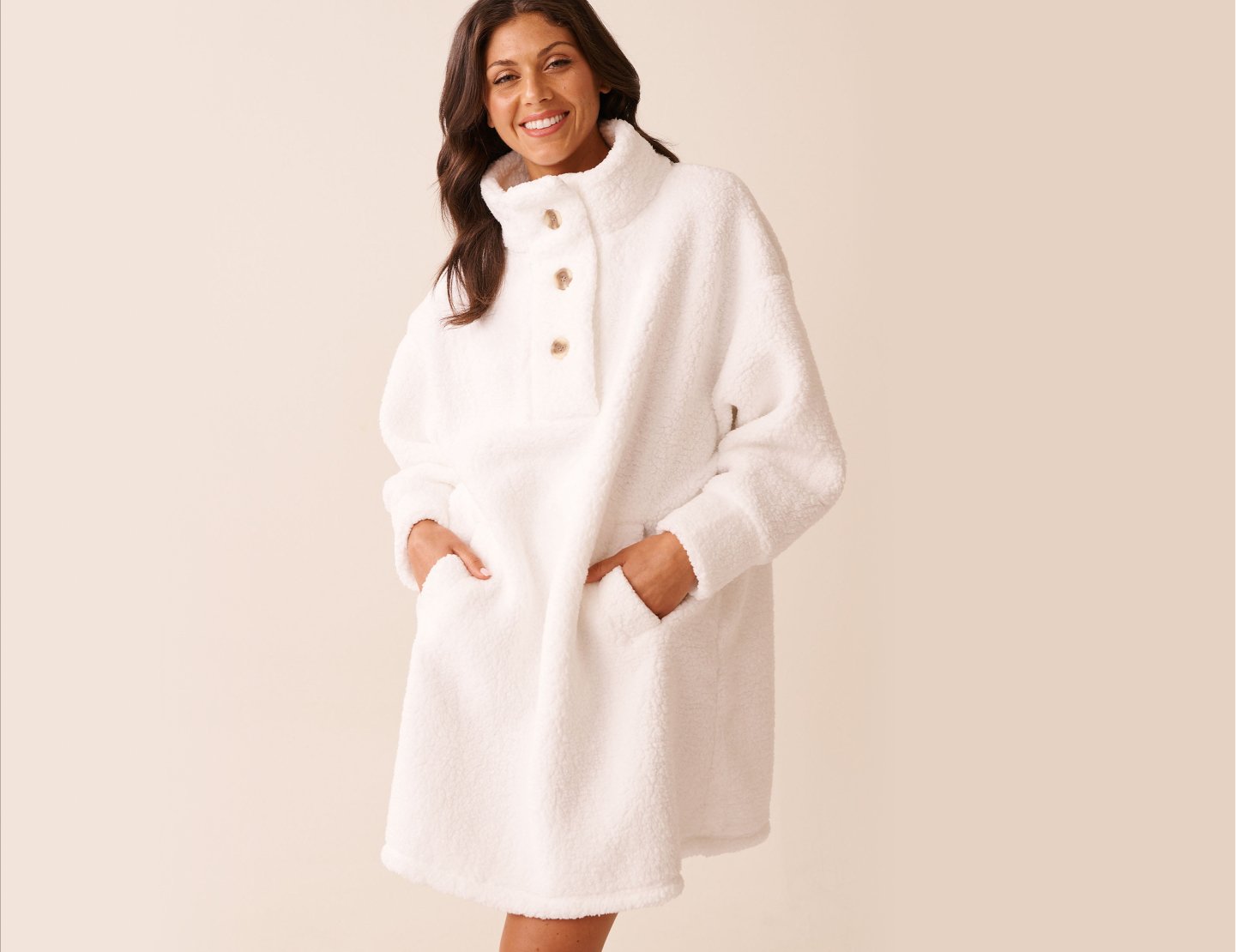 Model wearing an oversized white button-up sweatshirt