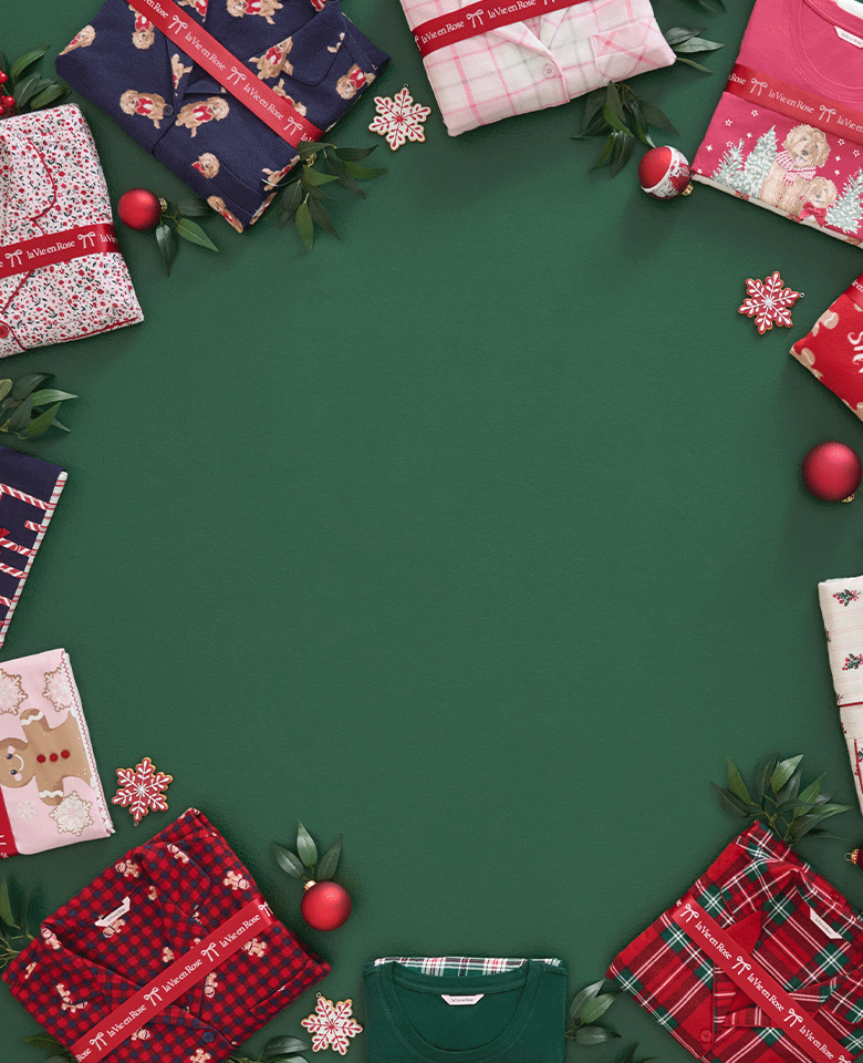 Folded pajama sets with festive prints arranged in a circle on green background, 2-for-1 offer