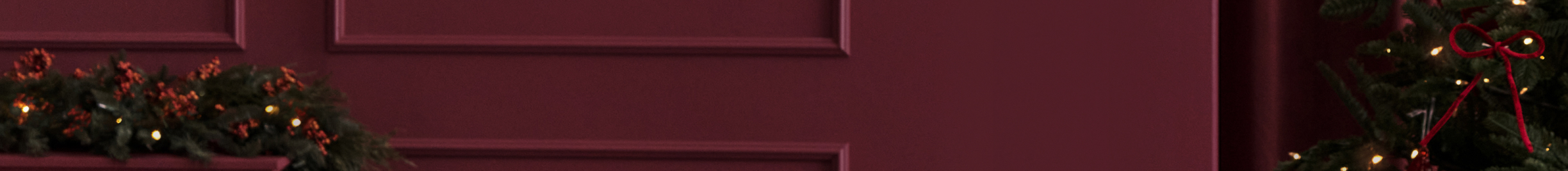 Holiday perks listed on a burgundy Christmas background