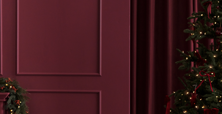 Holiday perks listed on a burgundy Christmas background