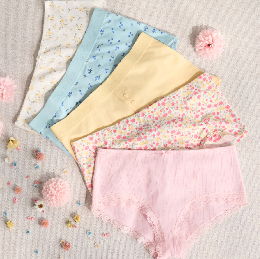 Back view of model wearing burgundy panties with black lace trim.