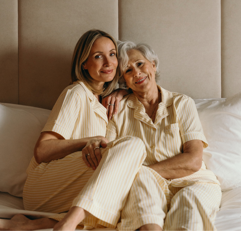 Liv Judd and her mother posing in yellow-and-white striped pajamas