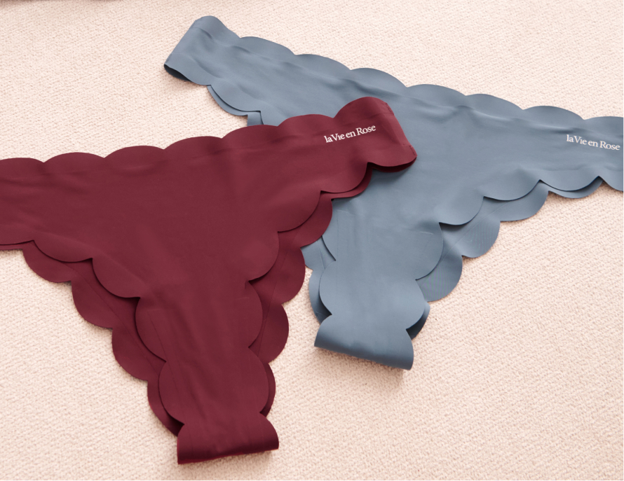 three pairs of panties: one blue, one pink, and one green