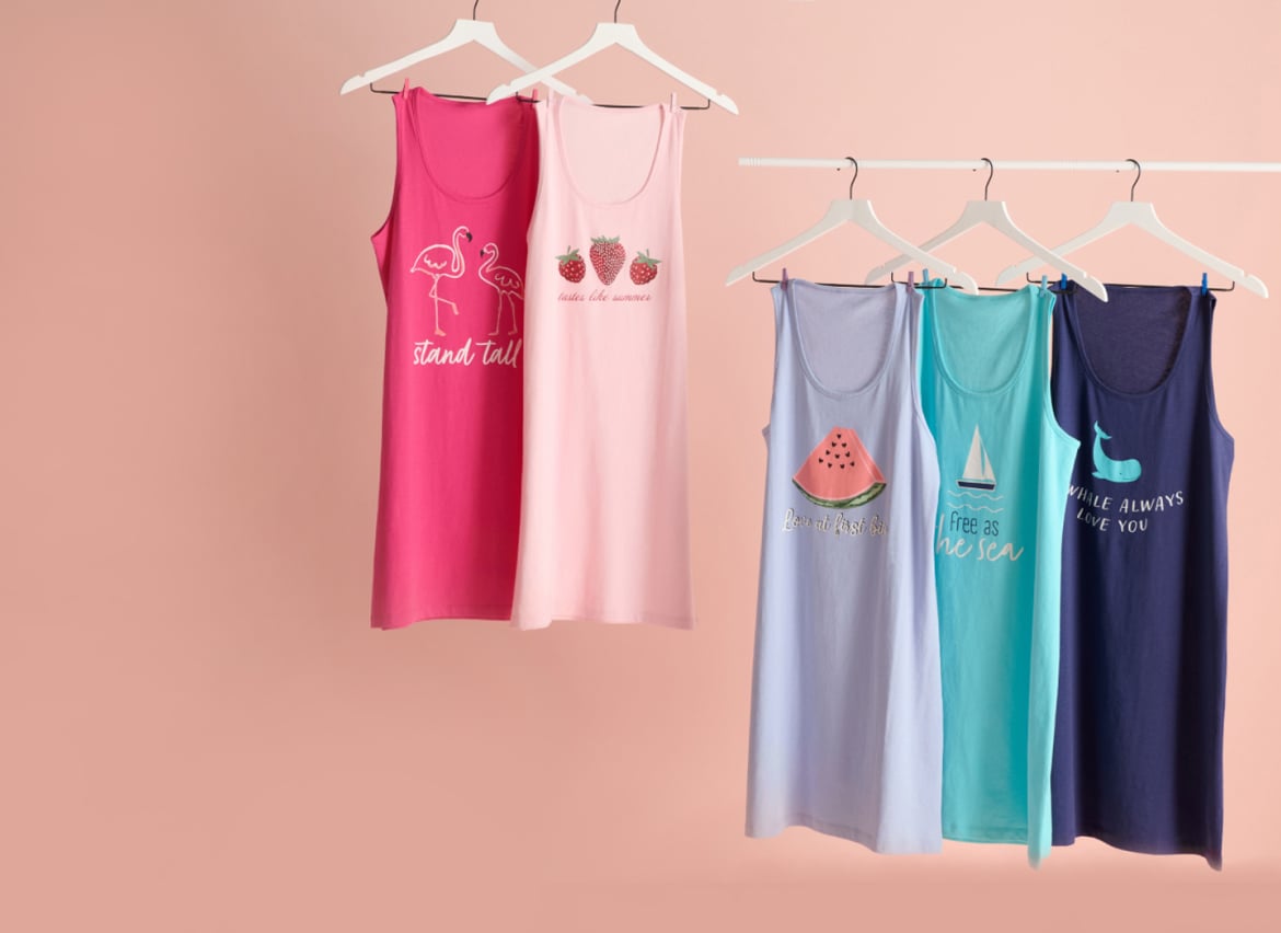 Five sleepshirts on hangers, pink and blue tones