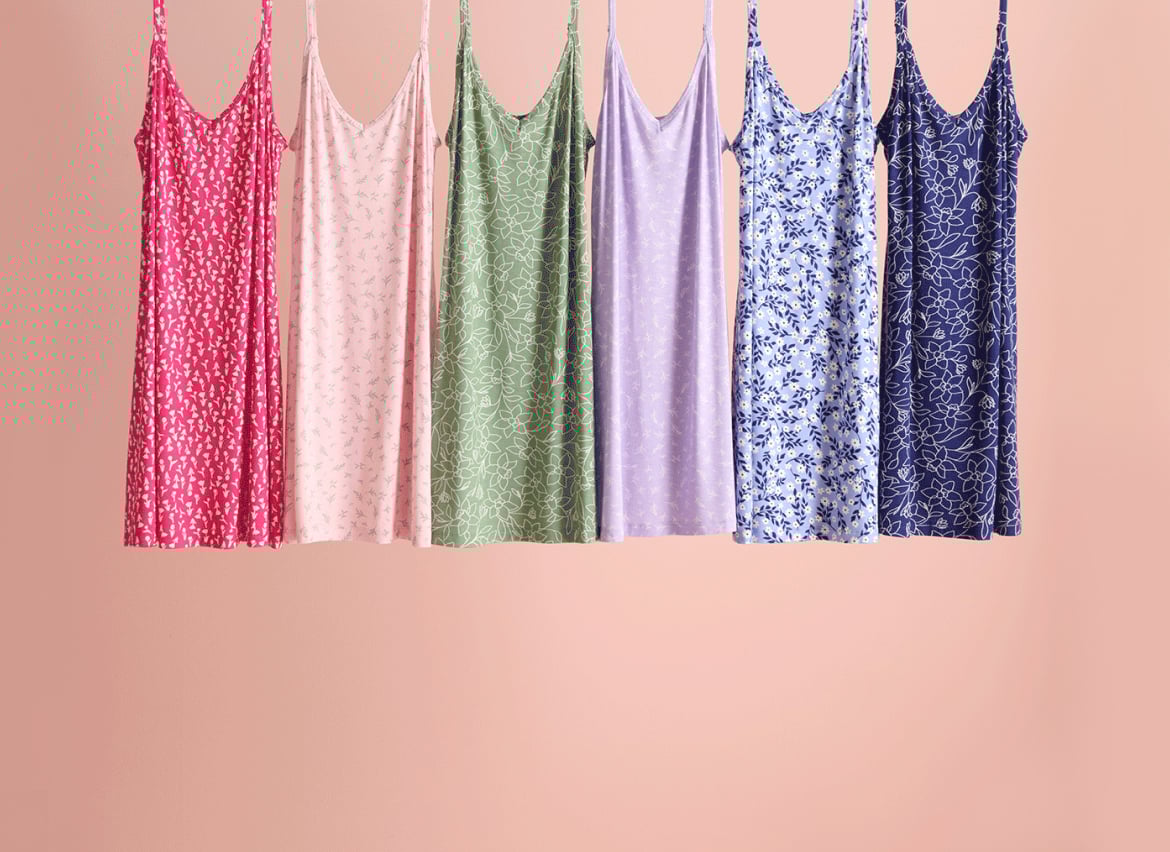 Six colourful nighties hanging, showcasing the styles available in our outlet sale.