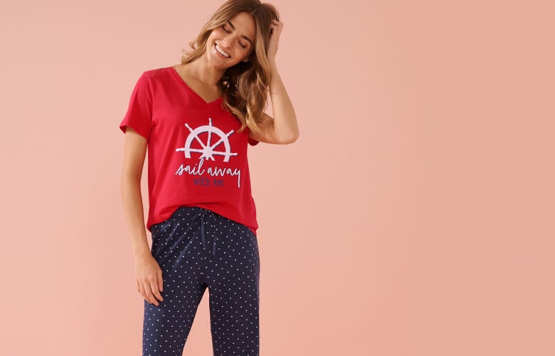 Three sets of patterned t-shirts and matching capris, showcasing the available styles in our outlet sale.