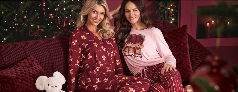 Models wearing pink pajamas with a mouse print