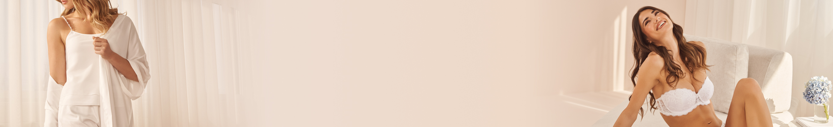 One model wearing white satin pajamas with pearls and another in a white lace bra.