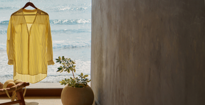 Model wearing a white textured tankini and matching swim bottoms