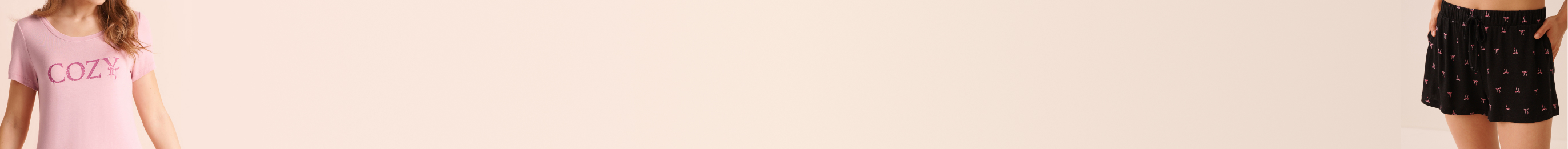 Model wearing pale pink pajamas