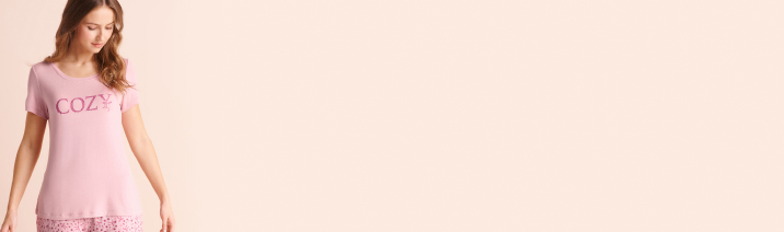 Model wearing pale pink pajamas