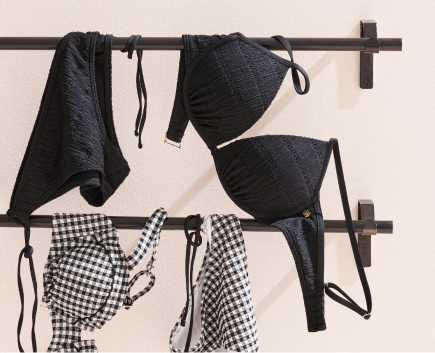 Brown textured tankini and matching bottoms, hanging on a line to dry