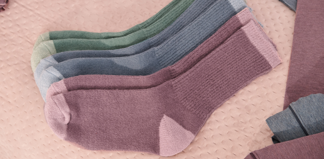 Pairs of purple, blue, and green socks