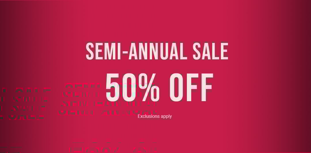 Model wearing a brown short-sleeve loungewear set with wide-leg pants.