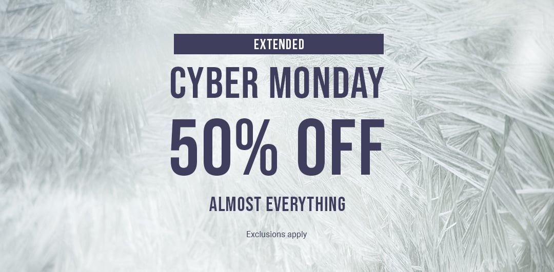 Plush bathrobes in soft tones, folded or tied.