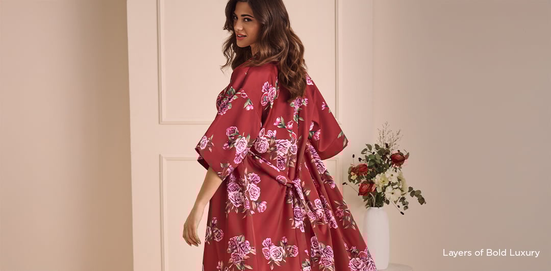 Image 34: Model in camisole, shorts, and black-and-white kimono with pink flowers.
