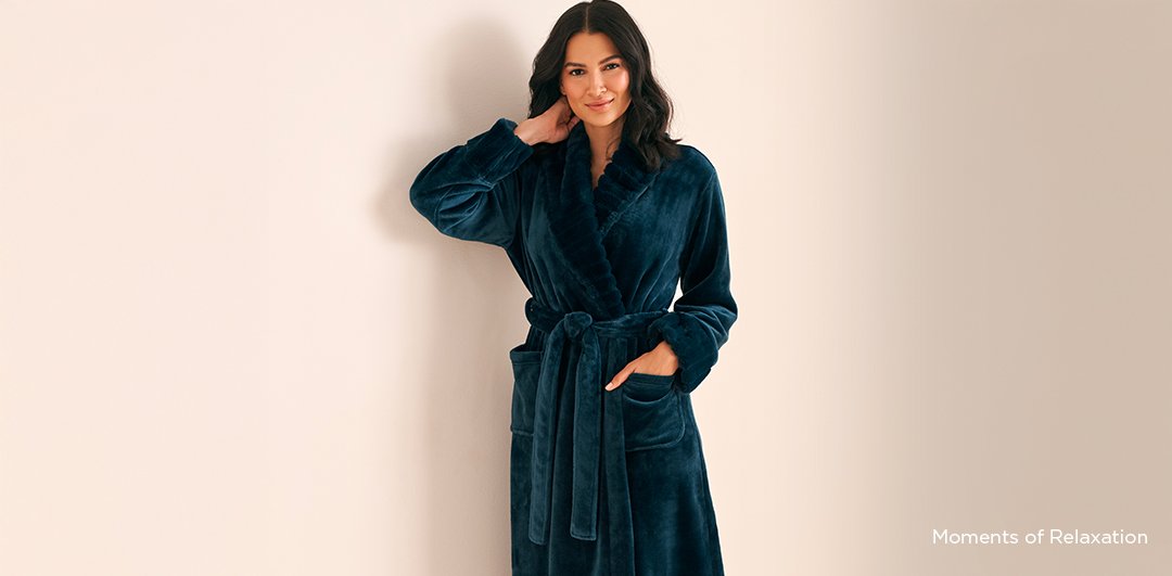 Model wearing a pink and white striped pajama nightie, featured in a banner for one of our spring trends, Coastal Dreaming.