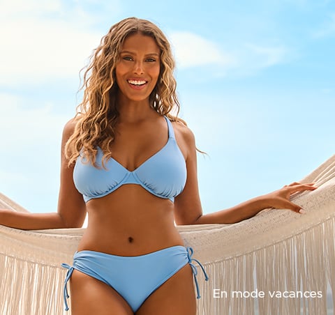 Mannequin de dos portant un haut de maillot noir et un pantalon de plage à motif floral