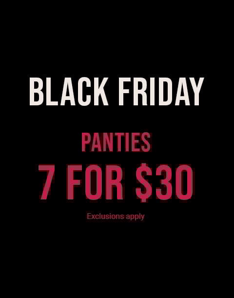 Model wearing a navy lace bra with matching strappy panty