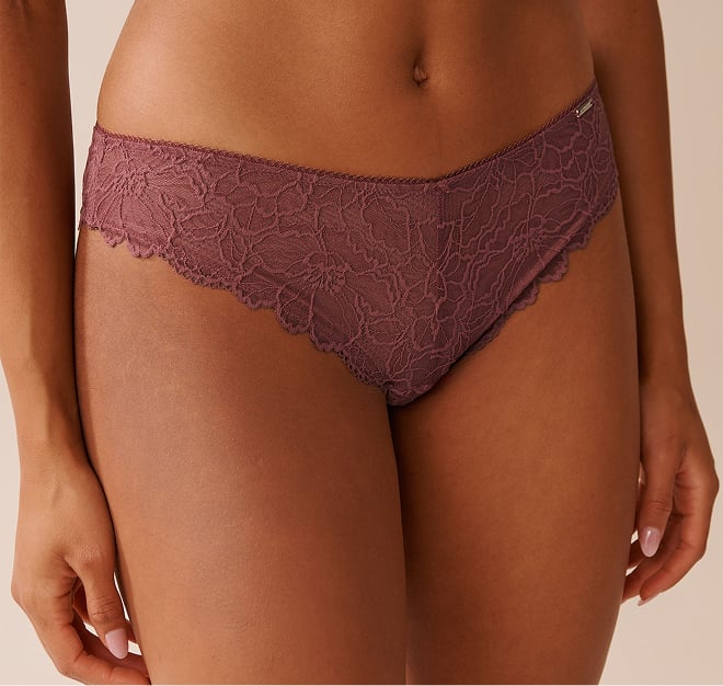 Black mesh panty with pink floral patterns.