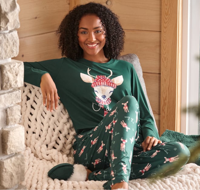 Two lounge bras lying on a blanket, one red, the other green.