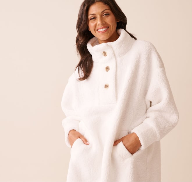 Model wearing an oversized white button-up sweatshirt