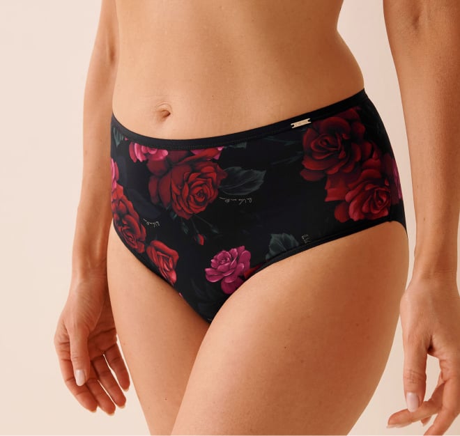 Black mesh panty with pink floral patterns.