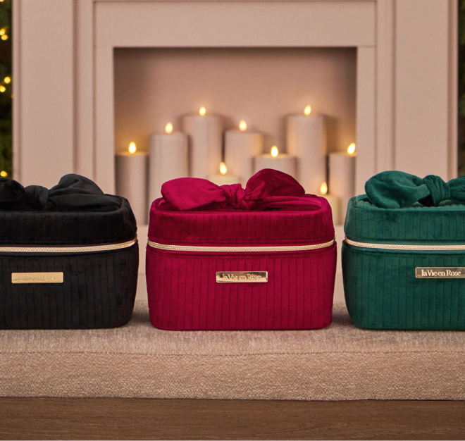 Three cosmetic bags: one black, one red, and one green