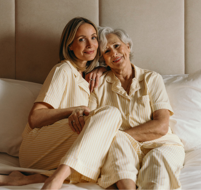 Liv Judd and her mother posing in yellow-and-white striped pajamas