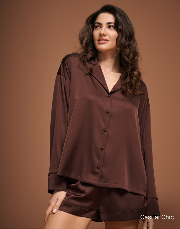 Model wearing a brown satin long-sleeved blouse and matching shorts