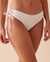 LA VIE EN ROSE AQUA Bas de bikini cheeky noué texturé en fibres recyclées Blanc 70300522 - View1